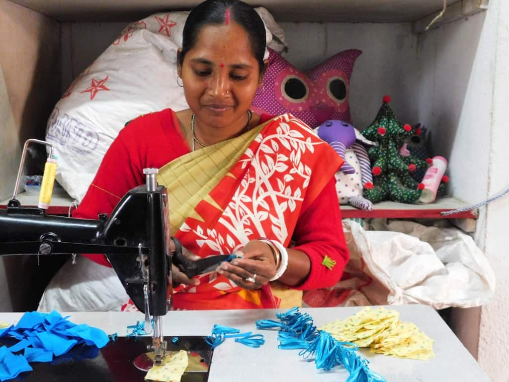 Prachesta-woman-at-sewing-machine Woman working at sewing machine at Prachesta